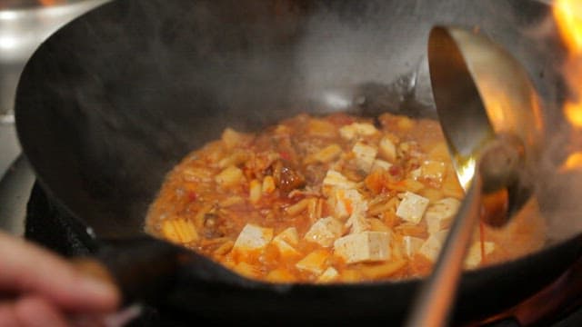 Mapo tofu cooked in a hot wok