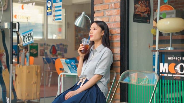 Young woman relaxing and drinking coffee