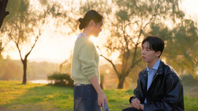 Couple arguing in a sunny park