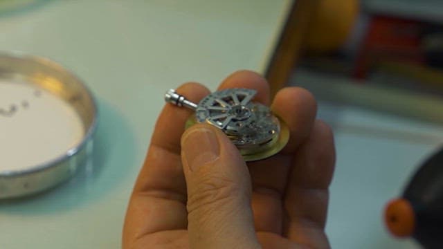 Expert Craftsman Repairing Intricate Watch Parts