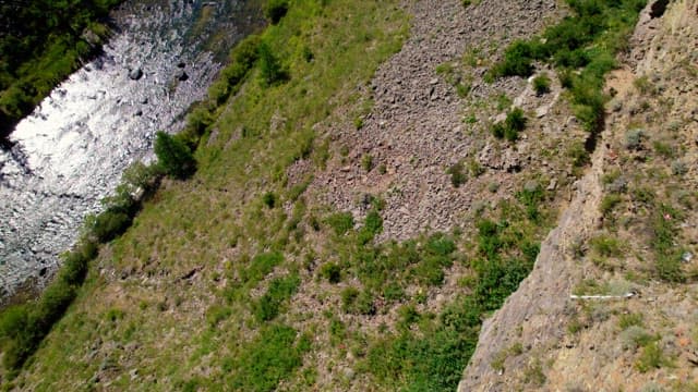 Person Looking at a Deep Canyon Created by Lava Flow