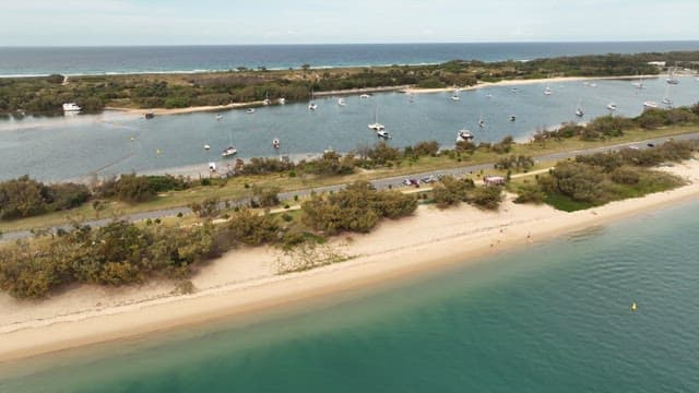 Aerial View of Boats Anchored in a Coastal Inlet