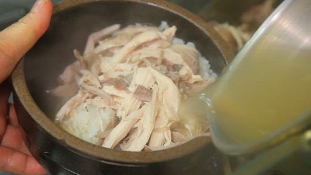 Adding broth to a ripe chicken