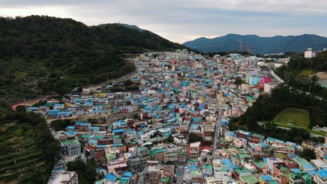 Colorful residential area nestled on a green hill