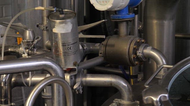 Industrial machinery with various metal parts and digital gauges in the factory