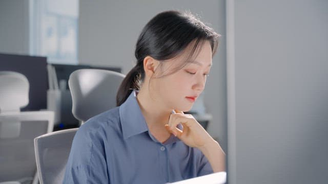 Woman working at a desk in an office