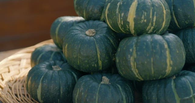Sweet Pumpkins Stacked Neatly on a Wooden Tray
