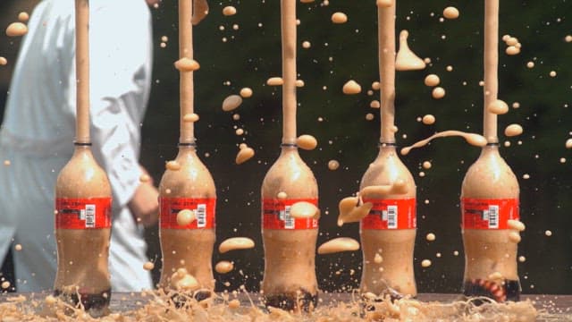 Outdoor science explosive experiment with soda and candies