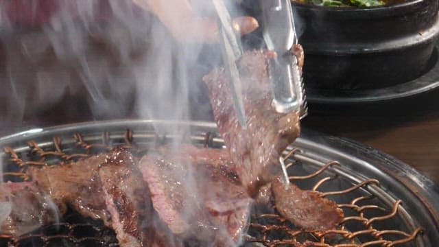 Sizzling beef on a grill