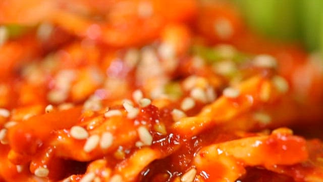 Spicy and sour swordtip squid salad with sesame seeds