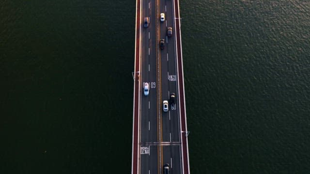 Bridge from a Quiet River to a Bustling City