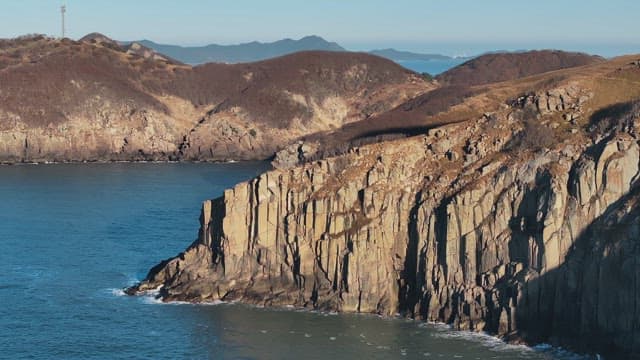 Scenic Aerial View of Coastal Cliffs at Sunset
