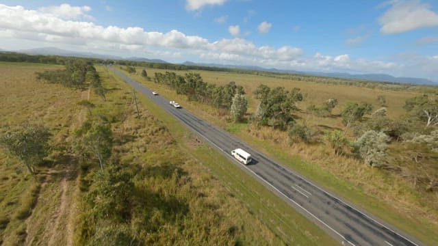 Long road through a rural landscape