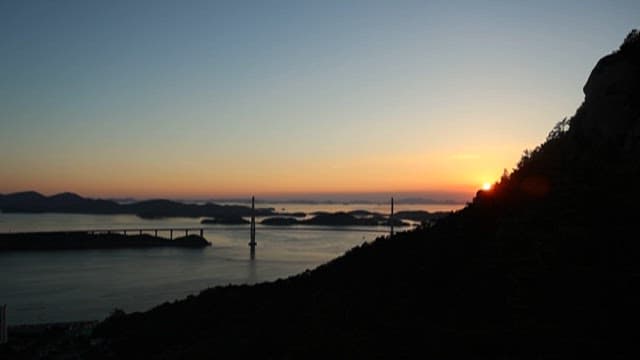 Island Sunset with Silhouetted Bridge