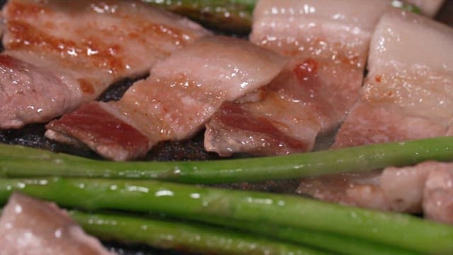 Thin-sliced Pork Belly and Asparagus Grilling on a Hot Pan