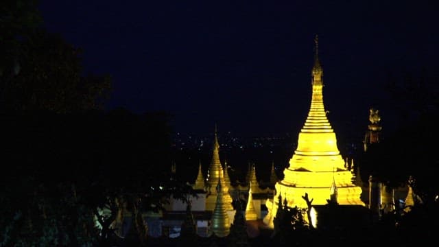 Illuminated Shwedagon Pagoda Against Night Sky