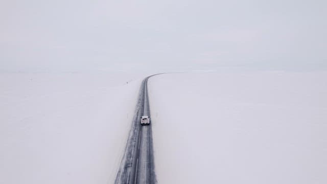 Car driving on a snowy road