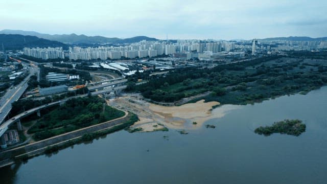Urban apartment view with river and bridge