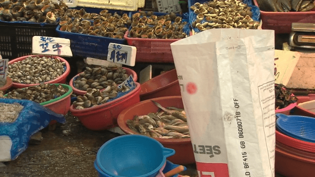 Traditional market with fresh seafood on display