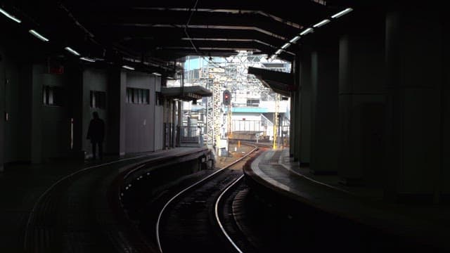 Train arriving at an urban station platform