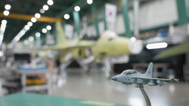 South Korean fighter jets being assembled at an industrial facility