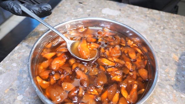 Pickled Mushrooms in a Stainless Steel Bowl