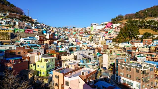 Day to night view of a Gamcheon Culture Village with colorful residential buildings