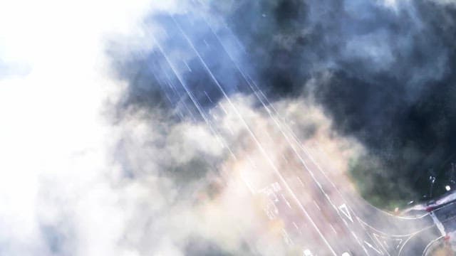 Highway shrouded in mist and clouds