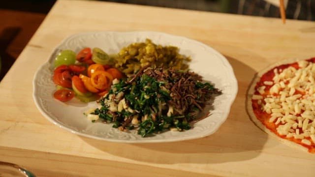 Preparing a homemade korean pizza with fresh ingredients