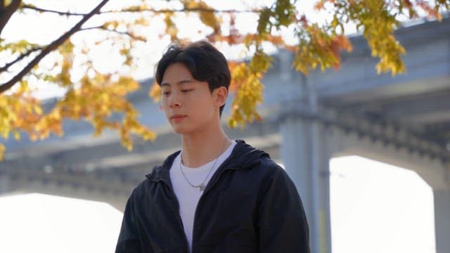 Man skipping rope under autumn tree