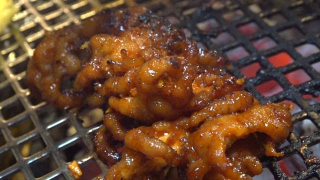 Seasoned chicken feet grilled on a grill