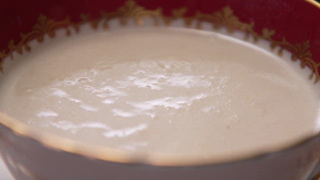 Scooping Warm Porridge with a Spoon