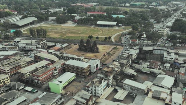 Overview of a Bustling Street with Ancient Temple Ruins