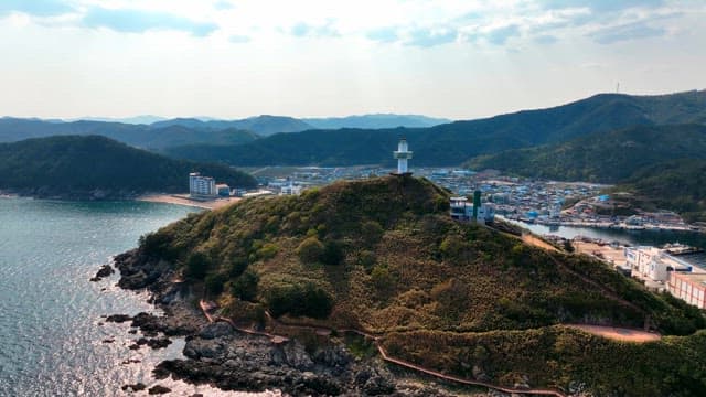 Lighthouse on a hill overlooking the sea