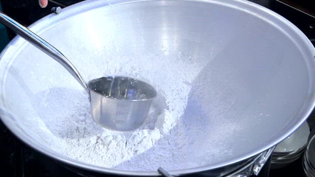 Mixing starch and water in a large bowl