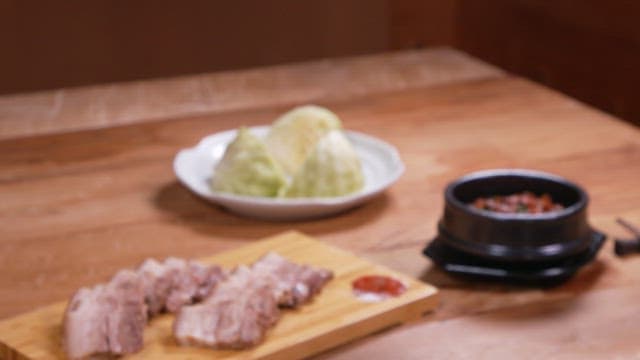 Healthy Korean meal with boiled pork and boiled cabbage