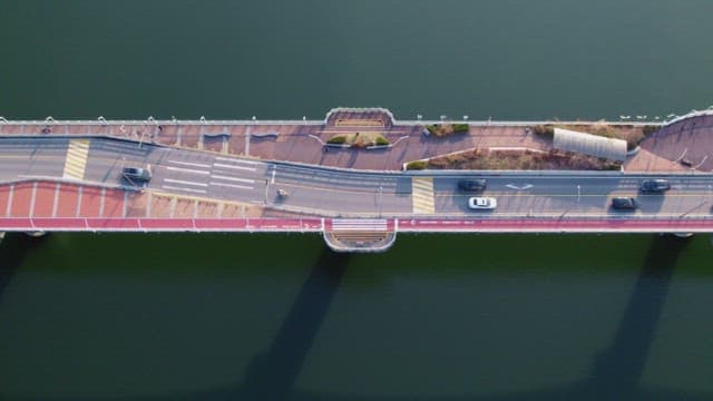 Cars driving on a bridge over water