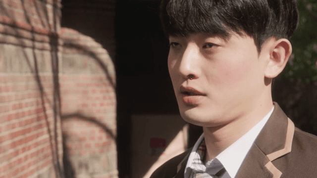 Male student collapsing with a nosebleed under the sun