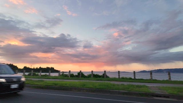 Scenic sunset view by the seaside road