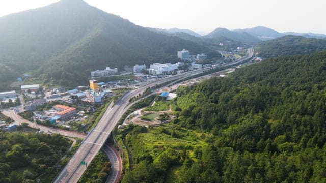 Scenic view of a town surrounded by mountains