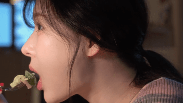 Woman enjoying a meal indoors