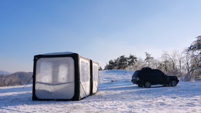 Winter Camping Scene with SUV and Tent