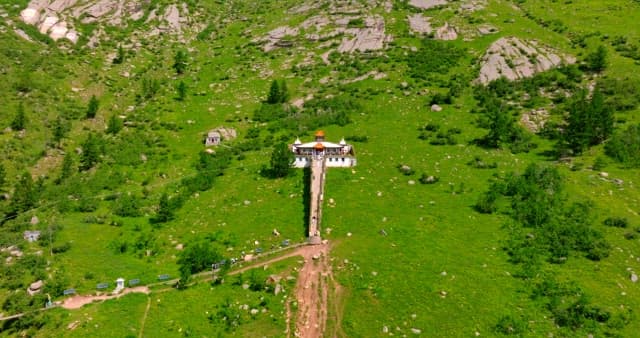 Temple on a lush green hillside