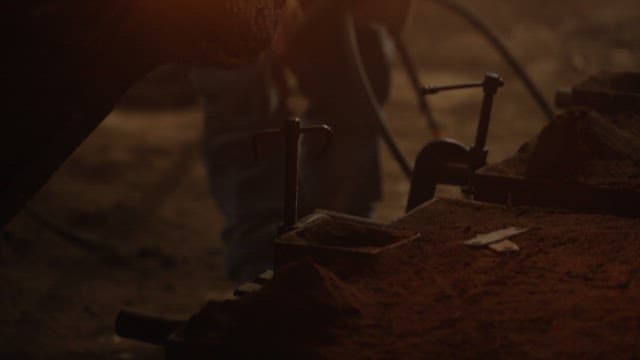 Molten metal being poured into a mold