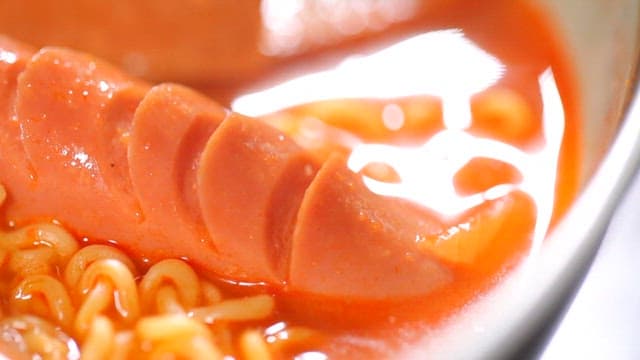 Sausage and ramen in spicy broth