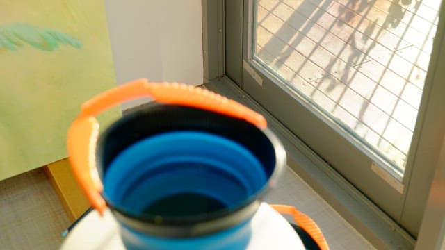 Water bucket on table during leisurely day time