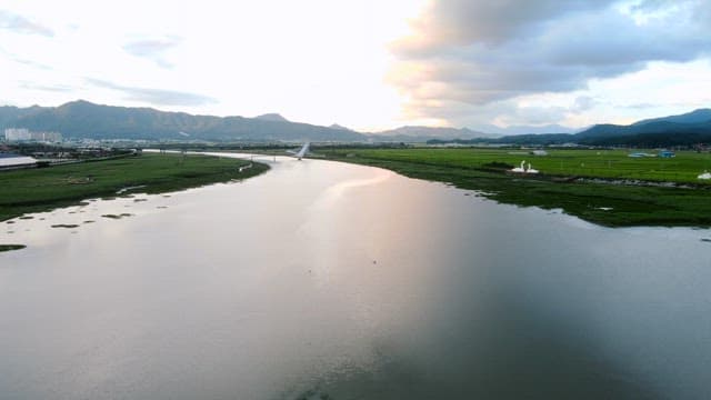 Serene river with distant mountains