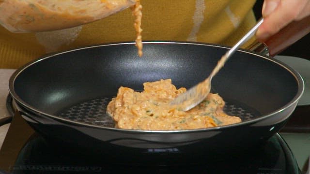 Kimchi pancake batter placed on a hot, oiled frying pan