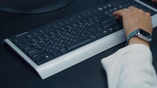 Close up of hand using mouse