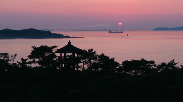 Sunset Over Horizon of Serene Ocean